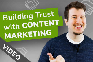 man pointing at a sign that reads "Building Trust with Content Marketing" 